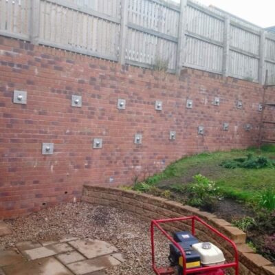 Platipus anchors garden wall stabilisation Garden wall stabilisation – hand driven anchors.